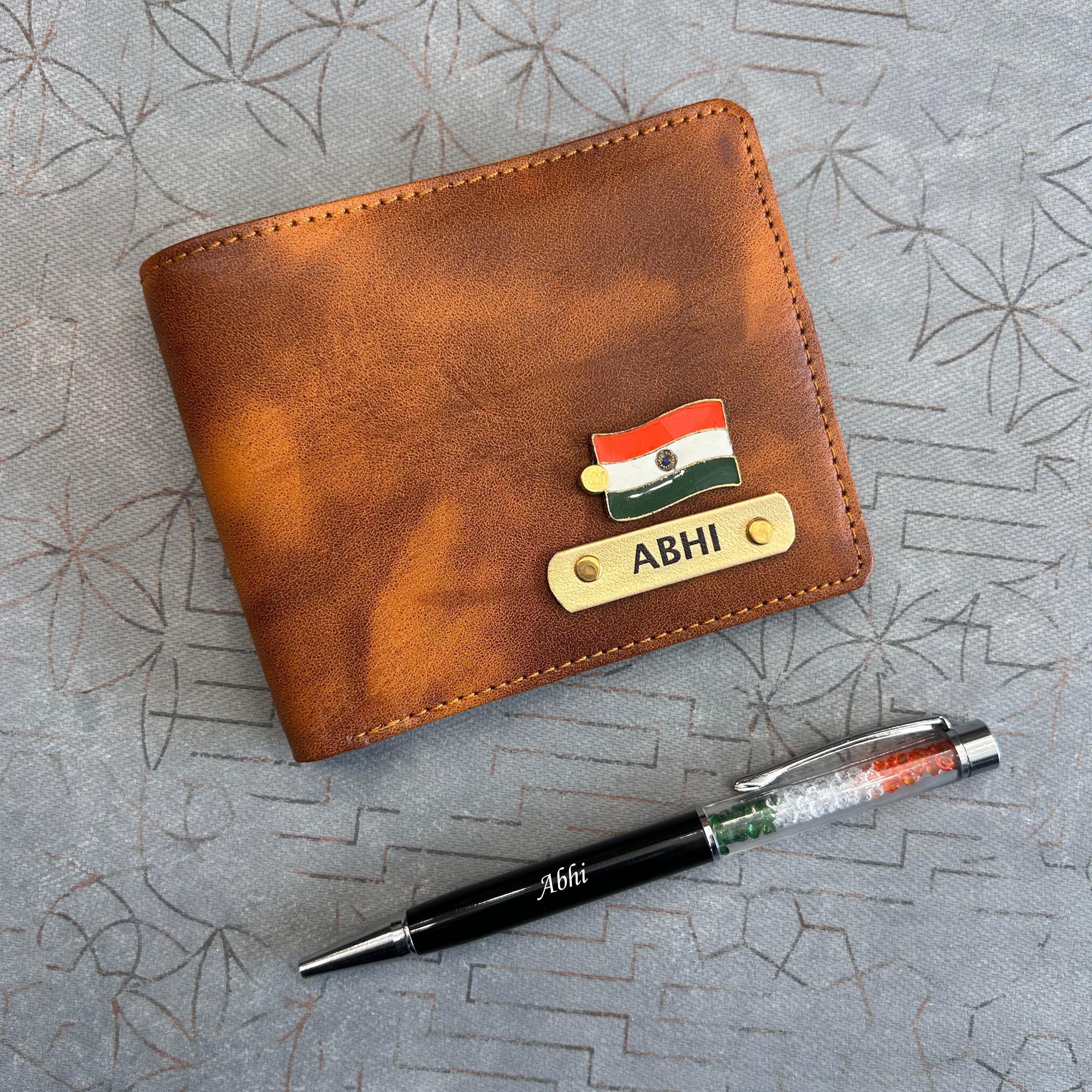 Brown leather wallet with nameplate and pen on a textured surface in India theme