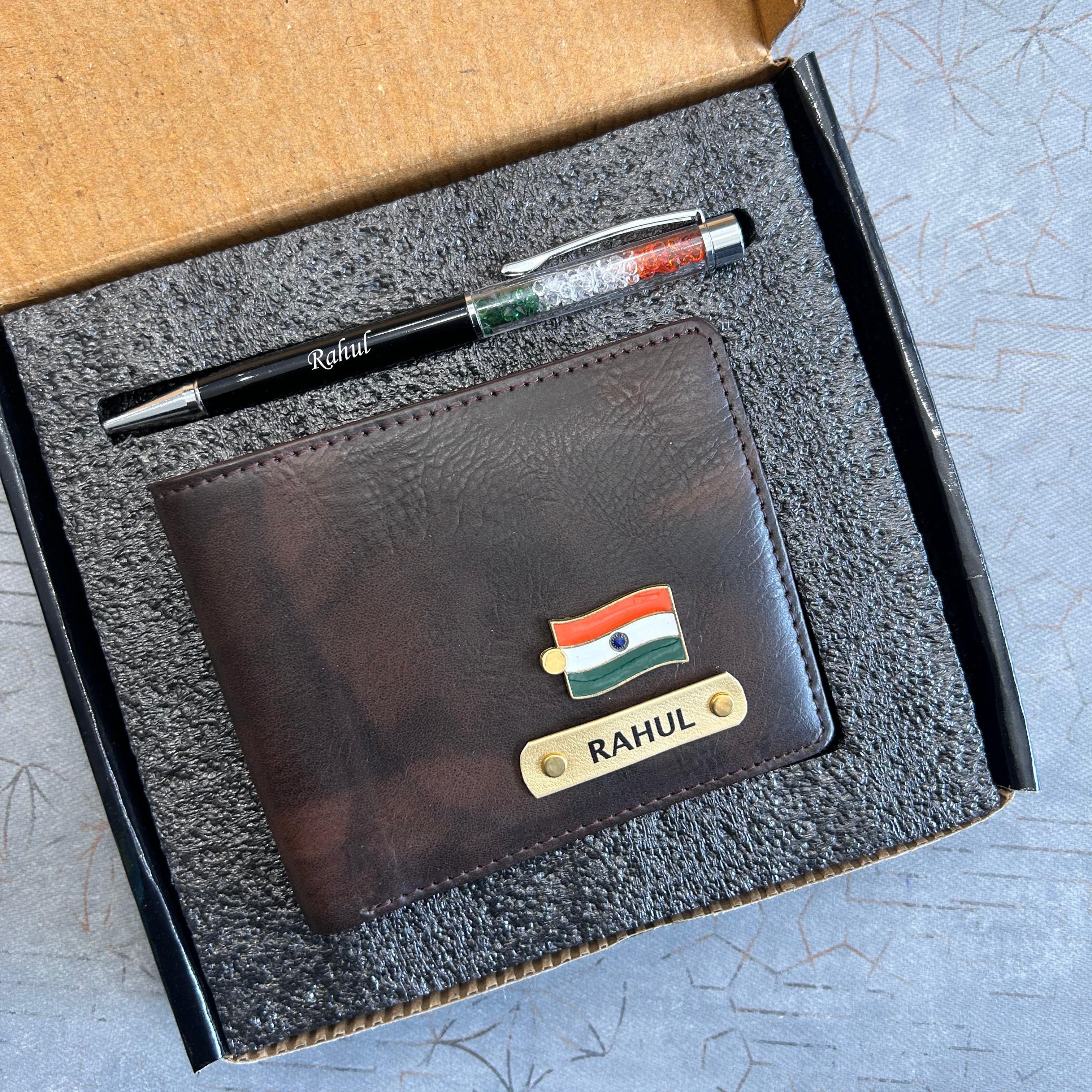 Brown leather wallet with nameplate and pen on a textured surface in India theme - The Gifting Era 